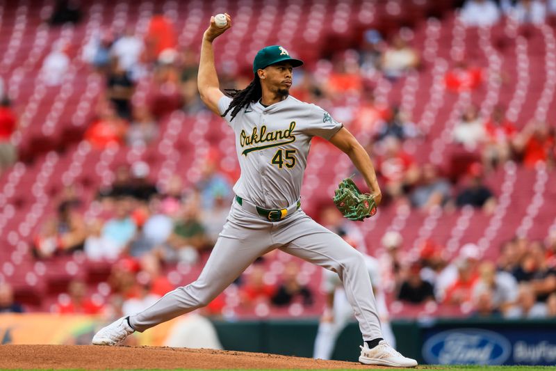 Aug 28, 2024; Cincinnati, Ohio, USA; Oakland Athletics starting pitcher Osvaldo Bido (45) pitches against the Cincinnati Reds in the first inning at Great American Ball Park. Mandatory Credit: Katie Stratman-USA TODAY Sports