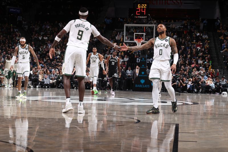 BROOKLYN, NY - DECEMBER 8: Bobby Portis #9 and Damian Lillard #0 of the Milwaukee Bucks high five during the game against the Brooklyn Nets on December 8, 2024 at Barclays Center in Brooklyn, New York. NOTE TO USER: User expressly acknowledges and agrees that, by downloading and or using this Photograph, user is consenting to the terms and conditions of the Getty Images License Agreement. Mandatory Copyright Notice: Copyright 2024 NBAE (Photo by Nathaniel S. Butler/NBAE via Getty Images)