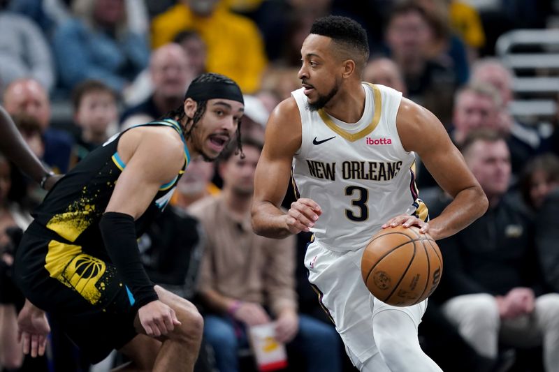 INDIANAPOLIS, INDIANA - FEBRUARY 28: CJ McCollum #3 of the New Orleans Pelicans dribbles the ball while being guarded by Andrew Nembhard #2 of the Indiana Pacers in the first quarter at Gainbridge Fieldhouse on February 28, 2024 in Indianapolis, Indiana. NOTE TO USER: User expressly acknowledges and agrees that, by downloading and or using this photograph, User is consenting to the terms and conditions of the Getty Images License Agreement. (Photo by Dylan Buell/Getty Images)