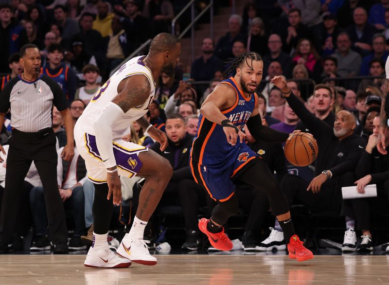 NEW YORK, NEW YORK - FEBRUARY 03:  Jalen Brunson #11 of the New York Knicks drives against LeBron James #23 of the Los Angeles Lakers during their game at Madison Square Garden on February 03, 2024 in New York City.   User expressly acknowledges and agrees that, by downloading and or using this photograph, User is consenting to the terms and conditions of the Getty Images License Agreement.  (Photo by Al Bello/Getty Images)