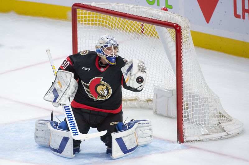 Sep 26, 2024; Ottawa, Ontario, CAN; Ottawa Senators goalie Dustin Tokarski (30) makes a save in the third period against the Buffalo Sabres at the Canadian Tire Centre. Mandatory Credit: Marc DesRosiers-Imagn Images