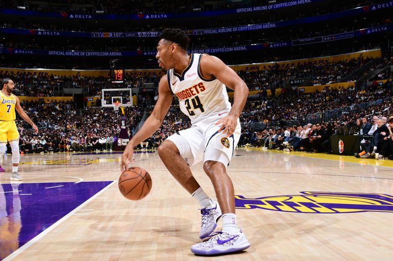 LOS ANGELES, CA - MARCH 19: Jalen Pickett #24 of the Denver Nuggets dribbles the ball during the game against the Los Angeles Lakers on March 19, 2025 at Crypto.Com Arena in Los Angeles, California. NOTE TO USER: User expressly acknowledges and agrees that, by downloading and/or using this Photograph, user is consenting to the terms and conditions of the Getty Images License Agreement. Mandatory Copyright Notice: Copyright 2025 NBAE (Photo by Adam Pantozzi/NBAE via Getty Images)