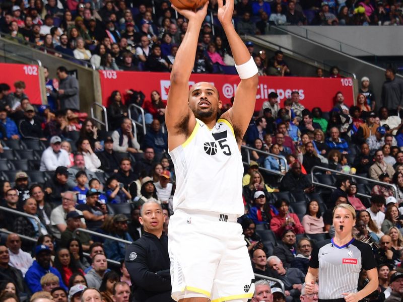 LOS ANGELES, CA - APRIL 5:  Talen Horton-Tucker #5 of the Utah Jazz shoots a 3-point basket during the game  on April 5, 2024 at Crypto.Com Arena in Los Angeles, California. NOTE TO USER: User expressly acknowledges and agrees that, by downloading and/or using this Photograph, user is consenting to the terms and conditions of the Getty Images License Agreement. Mandatory Copyright Notice: Copyright 2024 NBAE (Photo by Adam Pantozzi/NBAE via Getty Images)