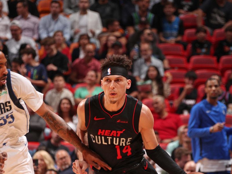 MIAMI, FL - APRIL 10:Tyler Herro #14 of the Miami Heat dribbles the ball during the game against the Dallas Mavericks   on April 10, 2024 at Kaseya Center in Miami, Florida. NOTE TO USER: User expressly acknowledges and agrees that, by downloading and or using this Photograph, user is consenting to the terms and conditions of the Getty Images License Agreement. Mandatory Copyright Notice: Copyright 2024 NBAE (Photo by Issac Baldizon/NBAE via Getty Images)