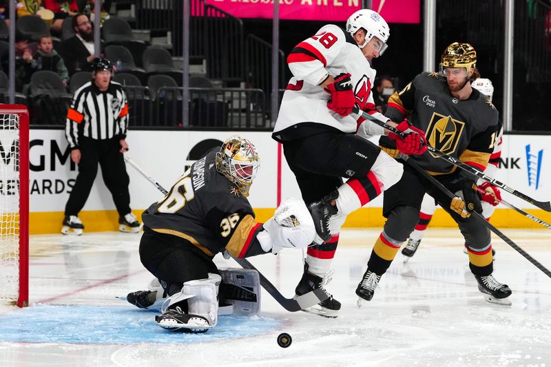 Mar 17, 2024; Las Vegas, Nevada, USA; Vegas Golden Knights goaltender Logan Thompson (36) protects his net as a shot deflects off New Jersey Devils right wing Timo Meier (28) during the second period at T-Mobile Arena. Mandatory Credit: Stephen R. Sylvanie-USA TODAY Sports