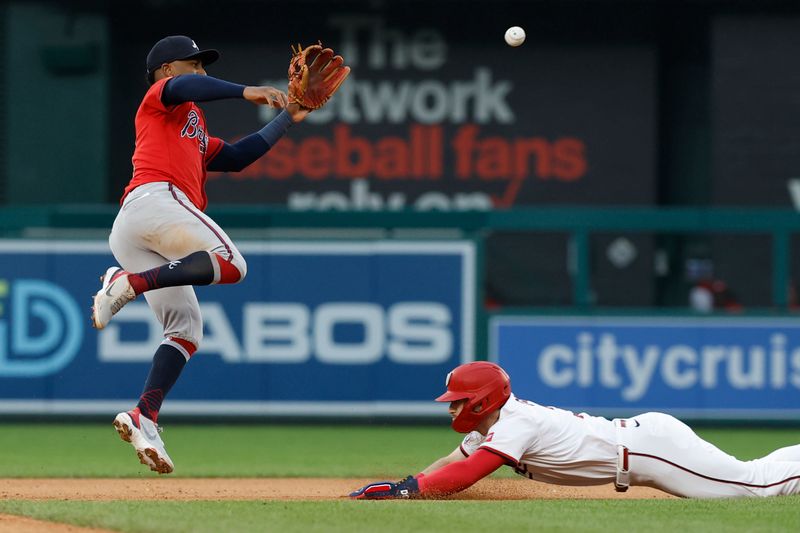 Sep 17, 2025; Washington, District of Columbia, USA; Washington Nationals outfielder Dylan Crews (3) steals second base ahead of a throw to Atlanta Braves second baseman Ozzie Albies (1) during the fifth inning at Nationals Park. Mandatory Credit: Geoff Burke-Imagn Images