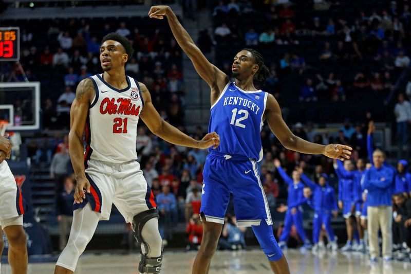 Jan 31, 2023; Oxford, Mississippi, USA; Kentucky Wildcats guard Antonio Reeves (12) holds after attempting a three-point shot during the first half against the Mississippi Rebels at The Sandy and John Black Pavilion at Ole Miss. Mandatory Credit: Petre Thomas-USA TODAY Sports