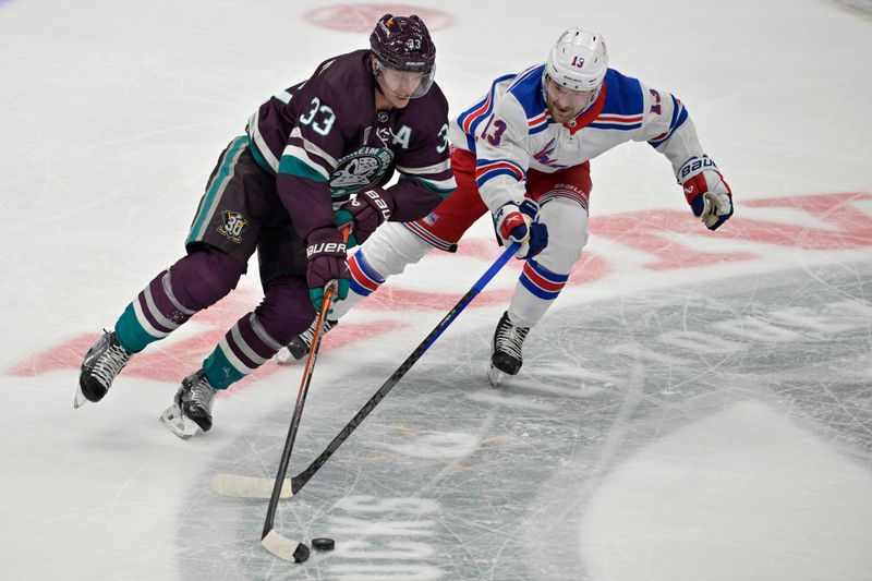 Jan 21, 2024; Anaheim, California, USA; Anaheim Ducks right wing Jakob Silfverberg (33) and New York Rangers left wing Alexis Lafreniere (13) battle for the puck in the first period at Honda Center. Mandatory Credit: Jayne Kamin-Oncea-USA TODAY Sports