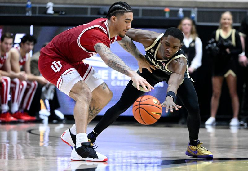 Feb 25, 2023; West Lafayette, Indiana, USA; Purdue Boilermakers guard Brandon Newman (5) knocks a ball away from Indiana Hoosiers guard Jalen Hood-Schifino (1) during the second half at Mackey Arena. Indiana won 79-71. Mandatory Credit: Marc Lebryk-USA TODAY Sports