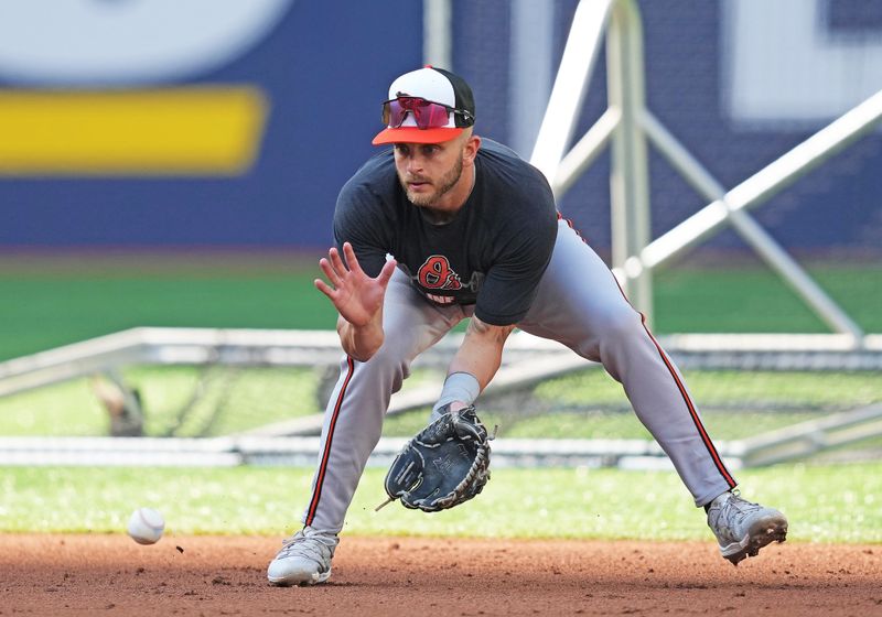 Jun 3, 2024; Toronto, Ontario, CAN; Baltimore Orioles second baseman Connor Norby (12) fields balls during batting practice before a game against the Toronto Blue Jays at Rogers Centre. Mandatory Credit: Nick Turchiaro-USA TODAY Sports