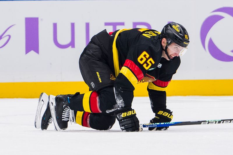 Nov 28, 2023; Vancouver, British Columbia, CAN; Vancouver Canucks forward Ilya Mikheyev (65) reacts after an injury against the Anaheim Ducks in the third period at Rogers Arena. Vancouver won 3-1. Mandatory Credit: Bob Frid-USA TODAY Sports