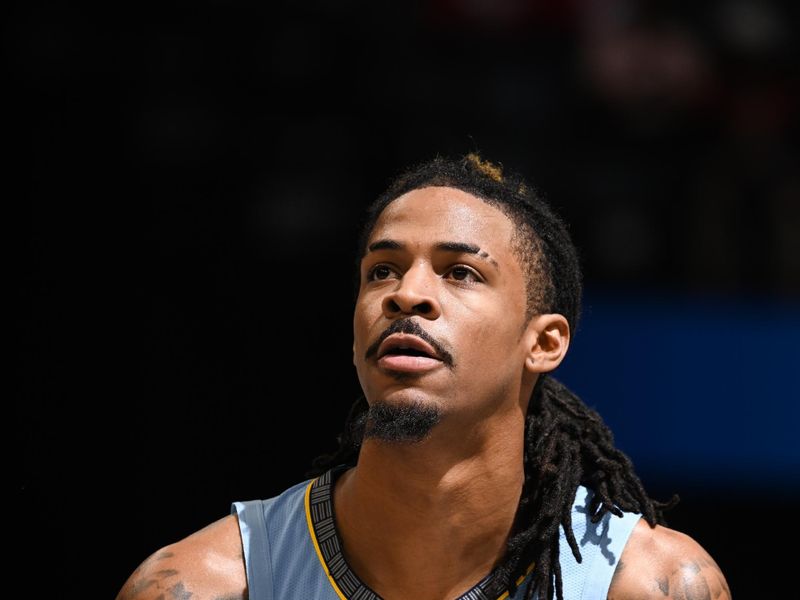 MEMPHIS, TN - NOVEMBER 29: Ja Morant #12 of the Memphis Grizzlies shoots a free throw during the game against the New Orleans Pelicans during the Emirates NBA Cup game on November 29, 2024 at FedExForum in Memphis, Tennessee. NOTE TO USER: User expressly acknowledges and agrees that, by downloading and or using this photograph, User is consenting to the terms and conditions of the Getty Images License Agreement. Mandatory Copyright Notice: Copyright 2024 NBAE (Photo by Grant Burke/NBAE via Getty Images)