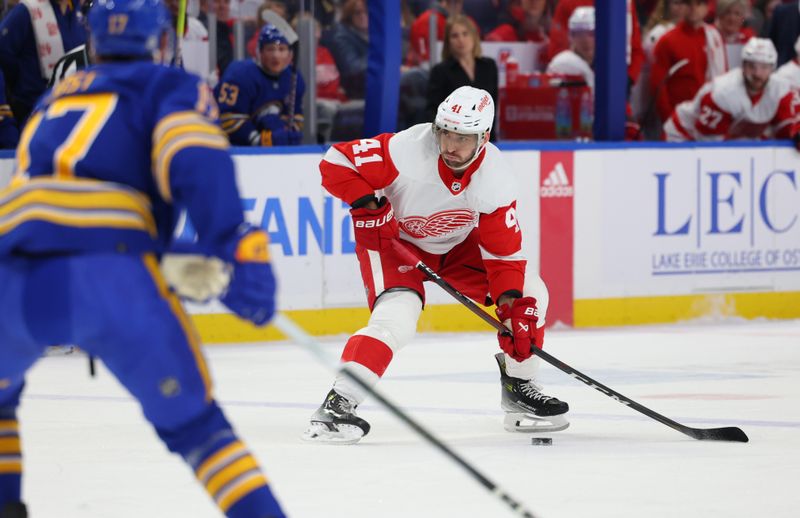 Dec 5, 2023; Buffalo, New York, USA;  Detroit Red Wings defenseman Shayne Gostisbehere (41) looks to make a pass during the first period against the Buffalo Sabres at KeyBank Center. Mandatory Credit: Timothy T. Ludwig-USA TODAY Sports