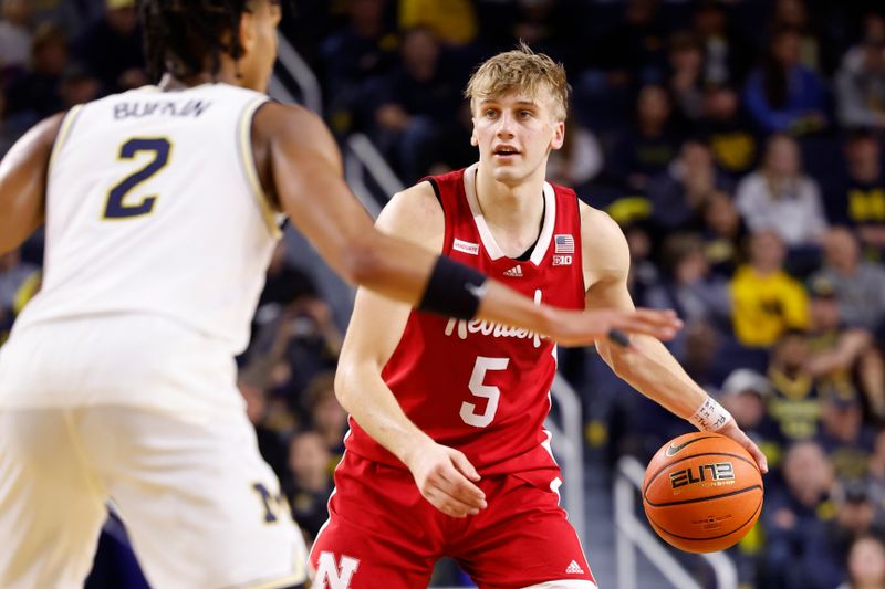 Feb 8, 2023; Ann Arbor, Michigan, USA;  Nebraska Cornhuskers guard Sam Griesel (5) dribbles defended by Michigan Wolverines guard Kobe Bufkin (2) in the second half at Crisler Center. Mandatory Credit: Rick Osentoski-USA TODAY Sports