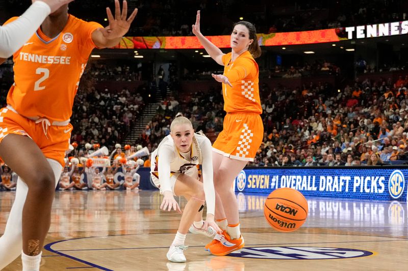 Mar 9, 2024; Greensville, SC, USA; South Carolina Gamecocks forward Chloe Kitts (21) loses the ball while defended by Tennessee Lady Vols guard Sara Puckett (1) during the second half at Bon Secours Wellness Arena. Mandatory Credit: Jim Dedmon-USA TODAY Sports