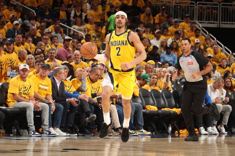 INDIANAPOLIS, IN - APRIL 26: Andrew Nembhard #2 of the Indiana Pacers dribbles the ball during the game against the Milwaukee Bucks during Round 1 Game 3 of the 2024 NBA Playoffs on April 26, 2024 at Gainbridge Fieldhouse in Indianapolis, Indiana. NOTE TO USER: User expressly acknowledges and agrees that, by downloading and or using this Photograph, user is consenting to the terms and conditions of the Getty Images License Agreement. Mandatory Copyright Notice: Copyright 2023 NBAE (Photo by Nathaniel S. Butler/NBAE via Getty Images)