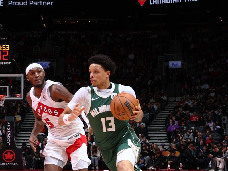 TORONTO, CANADA - JANUARY 6: Ryan Rollins #13 of the Milwaukee Bucks drives to the basket during the game against the Toronto Raptors on January 6, 2025 at the Scotiabank Arena in Toronto, Ontario, Canada.  NOTE TO USER: User expressly acknowledges and agrees that, by downloading and or using this Photograph, user is consenting to the terms and conditions of the Getty Images License Agreement.  Mandatory Copyright Notice: Copyright 2025 NBAE (Photo by Vaughn Ridley/NBAE via Getty Images)