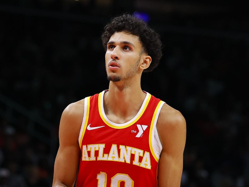 ATLANTA, GEORGIA - NOVEMBER 6: Zaccharie Risacher #10 of the Atlanta Hawks shoots from the line during the fourth quarter against the New York Knicks at State Farm Arena on November 6, 2024 in Atlanta, Georgia. NOTE TO USER: User expressly acknowledges and agrees that, by downloading and or using this photograph, User is consenting to the terms and conditions of the Getty Images License Agreement. (Photo by Todd Kirkland/Getty Images)