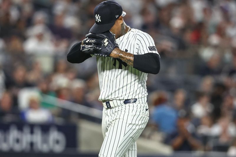 Jun 22, 2024; Bronx, New York, USA;  New York Yankees starting pitcher Marcus Stroman (0) walks off the field after being removed from the game in the seventh inning against the Atlanta Braves at Yankee Stadium. Mandatory Credit: Wendell Cruz-USA TODAY Sports