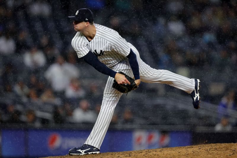 May 3, 2023; Bronx, New York, USA; New York Yankees relief pitcher Clay Holmes (35) follows through on a pitch against the Cleveland Guardians during the ninth inning at Yankee Stadium. Mandatory Credit: Brad Penner-USA TODAY Sports