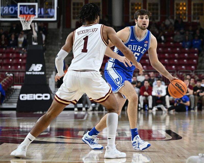 Jan 7, 2023; Chestnut Hill, Massachusetts, USA; Duke Blue Devils center Ryan Young (15) dribbles the ball against Boston College Eagles forward T.J. Bickerstaff (1) during the first half at the Conte Forum. Mandatory Credit: Brian Fluharty-USA TODAY Sports