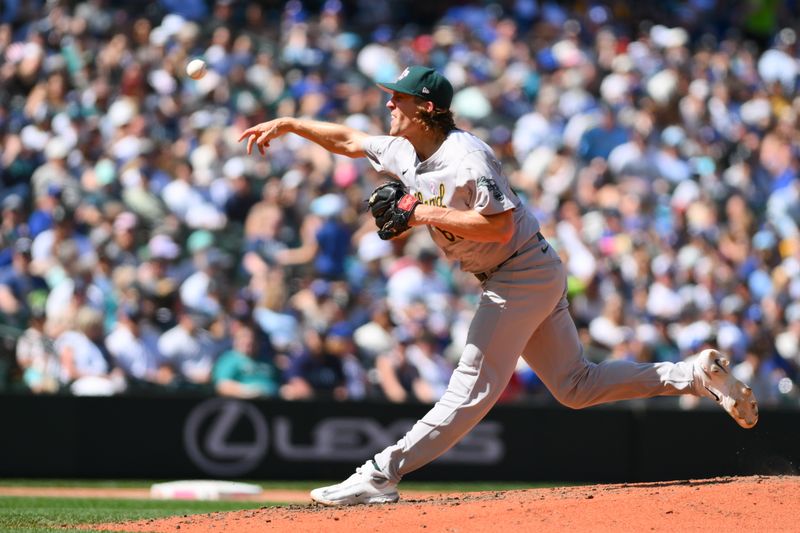 May 12, 2024; Seattle, Washington, USA; Oakland Athletics relief pitcher Tyler Ferguson (65) pitches to the Seattle Mariners during the seventh inning at T-Mobile Park. Mandatory Credit: Steven Bisig-USA TODAY Sports