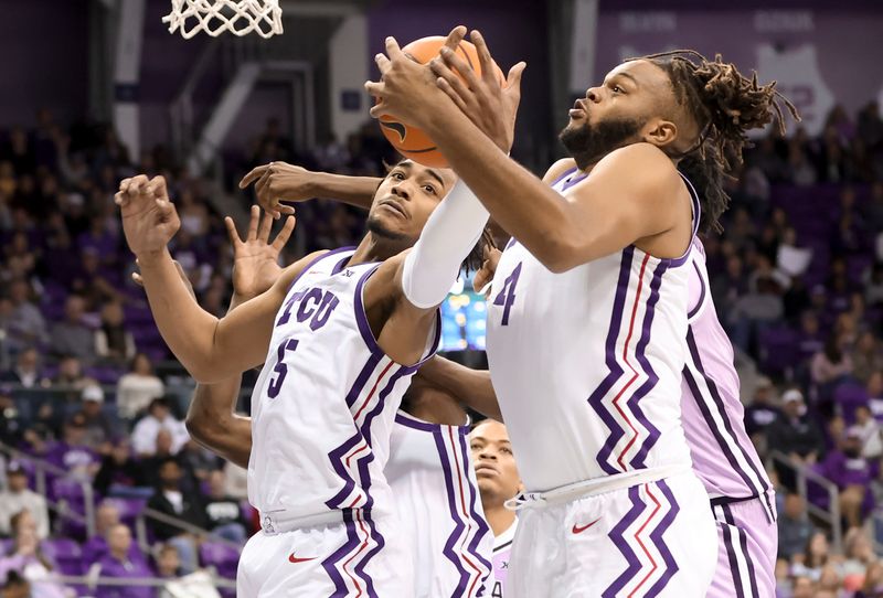 Jan 14, 2023; Fort Worth, Texas, USA;  TCU Horned Frogs center Eddie Lampkin Jr. (4) and TCU Horned Frogs forward Chuck O'Bannon Jr. (5) go for the ball during the second half against the Kansas State Wildcats at Ed and Rae Schollmaier Arena. Mandatory Credit: Kevin Jairaj-USA TODAY Sports