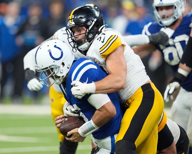 Indianapolis Colts quarterback Joe Flacco, left, is sacked by Pittsburgh Steelers linebacker Nick Herbig (51) during the second half of an NFL football game Sunday, Sept. 29, 2024, in Indianapolis. (AP Photo/Michael Conroy)