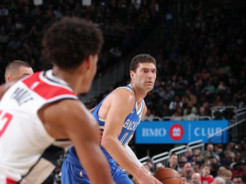 MILWAUKEE, WI - NOVEMBER 30: Brook Lopez #11 of the Milwaukee Bucks drives to the basket during the game against the Washington Wizards on November 30, 2024 at Fiserv Forum Center in Milwaukee, Wisconsin. NOTE TO USER: User expressly acknowledges and agrees that, by downloading and or using this Photograph, user is consenting to the terms and conditions of the Getty Images License Agreement. Mandatory Copyright Notice: Copyright 2024 NBAE (Photo by Gary Dineen/NBAE via Getty Images).