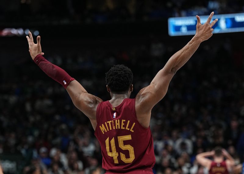 DALLAS, TX - JANUARY 03:  Donovan Mitchell #45 of the Cleveland Cavaliers celebrates a three point basket during the game against the Dallas Mavericks on January 3, 2025 at American Airlines Center in Dallas, Texas. NOTE TO USER: User expressly acknowledges and agrees that, by downloading and or using this photograph, User is consenting to the terms and conditions of the Getty Images License Agreement. Mandatory Copyright Notice: Copyright 2025 NBAE (Photo by Glenn James/NBAE via Getty Images)