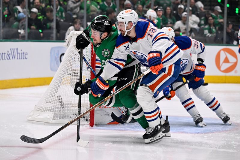 May 21, 2025; Dallas, Texas, USA; Dallas Stars center Roope Hintz (24) and Edmonton Oilers left wing Zach Hyman (18) skate for a puck in the second period during game one of the Western Conference Final of the 2025 Stanley Cup Playoffs at American Airlines Center. Mandatory Credit: Jerome Miron-Imagn Images