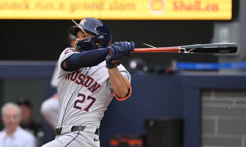 Jul 2, 2024; Toronto, Ontario, CAN;   Houston Astros second baseman Jose Altuve (27) breaks his bat as he hits a single against the Toronto Blue Jays in the first inning at Rogers Centre. Mandatory Credit: Dan Hamilton-USA TODAY Sports