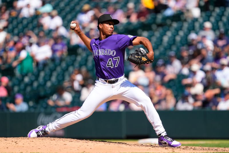 May 8, 2025; Denver, Colorado, USA; Colorado Rockies pitcher Juan Mejia (47) delivers a pitch in the eighth inning against the Detroit Tigers at Coors Field. Mandatory Credit: Ron Chenoy-Imagn Images