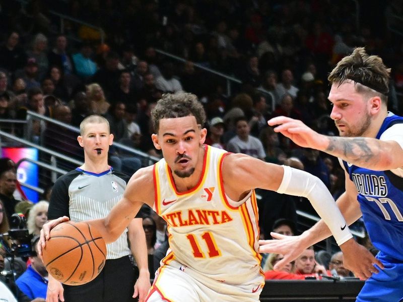 ATLANTA, GA - JANUARY 26: Trae Young #11 of the Atlanta Hawks drives to the basket during the game against the Dallas Mavericks on January 26, 2024 at State Farm Arena in Atlanta, Georgia.  NOTE TO USER: User expressly acknowledges and agrees that, by downloading and/or using this Photograph, user is consenting to the terms and conditions of the Getty Images License Agreement. Mandatory Copyright Notice: Copyright 2024 NBAE (Photo by Adam Hagy/NBAE via Getty Images)