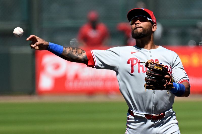 Mar 18, 2025; Bradenton, Florida, USA; Philadelphia Phillies shortstop Edmundo Sosa (33) throws to first base in the second  inning against the Pittsburgh Pirates during spring training at LECOM Park. Mandatory Credit: Jonathan Dyer-Imagn Images
