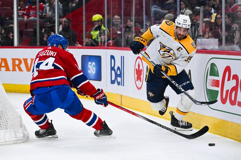 Dec 10, 2023; Montreal, Quebec, CAN; Nashville Predators defenseman Roman Josi (59) defends the puck against Montreal Canadiens center Nick Suzuki (14) during the first period at Bell Centre. Mandatory Credit: David Kirouac-USA TODAY Sports