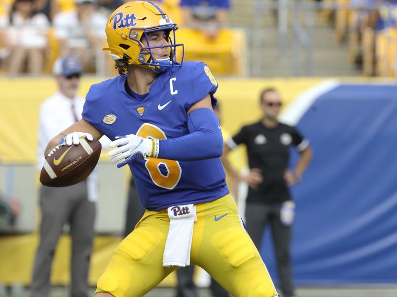 Sep 4, 2021; Pittsburgh, Pennsylvania, USA;  Pittsburgh Panthers quarterback Kenny Pickett (8) passes against the Massachusetts Minutemen during the second quarter at Heinz Field. Mandatory Credit: Charles LeClaire-USA TODAY Sports