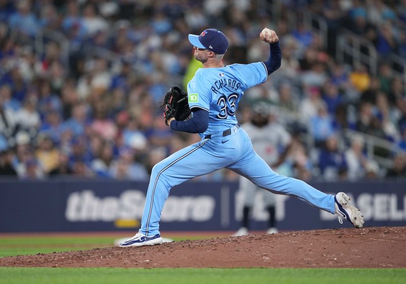 May 11, 2024; Toronto, Ontario, CAN; Toronto Blue Jays relief pitcher Trevor Richards (33) throws a pitch against the Minnesota Twins during the fifth inning at Rogers Centre. Mandatory Credit: Nick Turchiaro-USA TODAY Sports