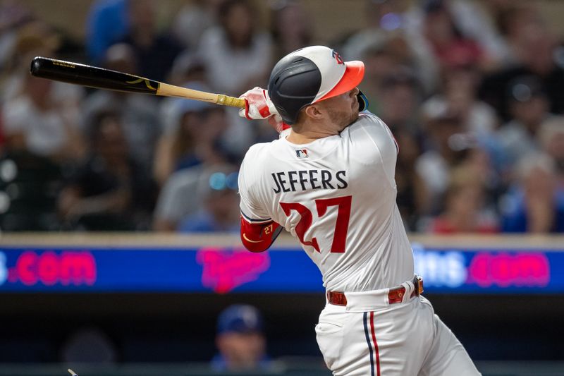 Aug 24, 2023; Minneapolis, Minnesota, USA; Minnesota Twins catcher Ryan Jeffers (27) hits a two run home run against the Texas Rangers in the eighth inning at Target Field. Mandatory Credit: Jesse Johnson-USA TODAY Sports