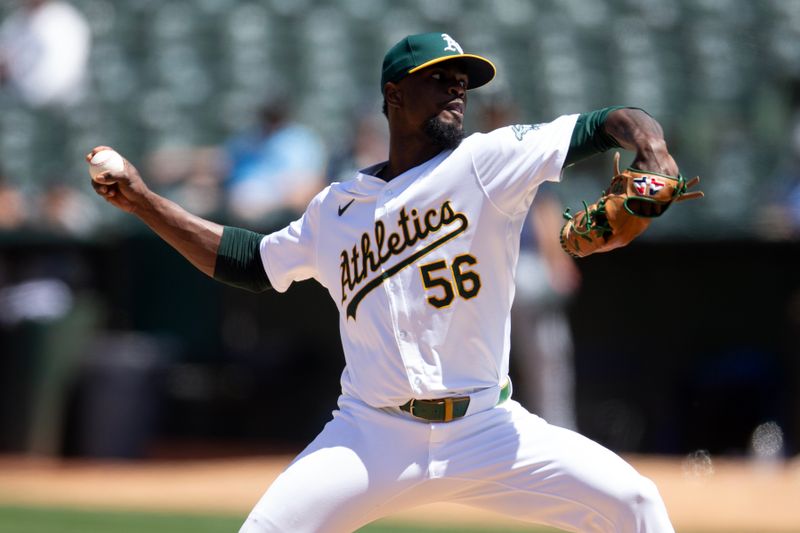 Jun 6, 2024; Oakland, California, USA; Oakland Athletics pitcher Dany Jimenez (56) delivers a pitch against the Seattle Mariners during the seventh inning at Oakland-Alameda County Coliseum. Mandatory Credit: D. Ross Cameron-USA TODAY Sports