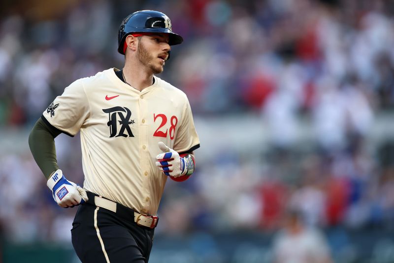 May 17, 2024; Arlington, Texas, USA; Texas Rangers catcher Jonah Heim (28) rounds the bases after hitting a home run in the second inning against the Los Angeles Angels at Globe Life Field. Mandatory Credit: Tim Heitman-USA TODAY Sports