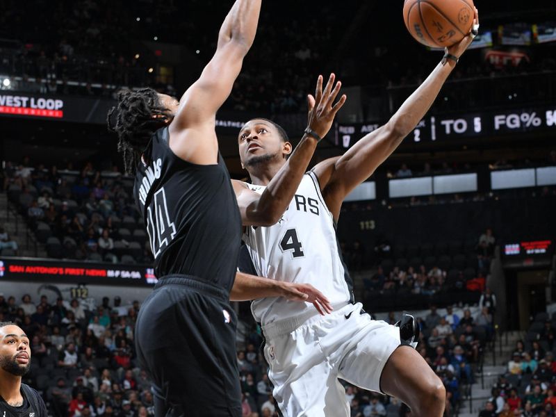 SAN ANTONIO, TX - MARCH 4: De'Aaron Fox #4 of the San Antonio Spurs drives to the basket during the game against the Brooklyn Nets on March 4, 2025 at the Frost Bank Center in San Antonio, Texas. NOTE TO USER: User expressly acknowledges and agrees that, by downloading and or using this photograph, user is consenting to the terms and conditions of the Getty Images License Agreement. Mandatory Copyright Notice: Copyright 2025 NBAE (Photos by Michael Gonzales/NBAE via Getty Images)