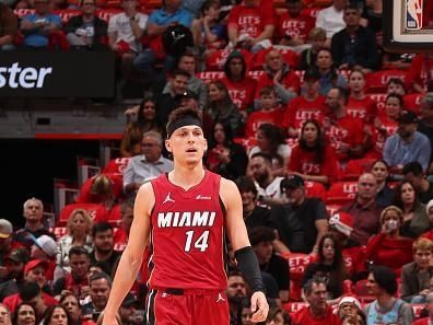 MIAMI, FL - DECEMBER 25:  Tyler Herro #14 of the Miami Heat looks on during the game on December 25, 2023 at Kaseya Center Arena in Miami, Florida. NOTE TO USER: User expressly acknowledges and agrees that, by downloading and or using this Photograph, user is consenting to the terms and conditions of the Getty Images License Agreement. Mandatory Copyright Notice: Copyright 2023 NBAE (Photo by Issac Baldizon/NBAE via Getty Images)