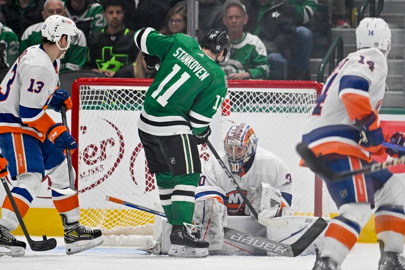 Feb 26, 2024; Dallas, Texas, USA; New York Islanders goaltender Ilya Sorokin (30) stops a shot by Dallas Stars center Logan Stankoven (11) during the third period at the American Airlines Center. Mandatory Credit: Jerome Miron-USA TODAY Sports