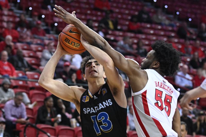 Feb 14, 2023; Las Vegas, Nevada, USA; San Jose State Spartans guard Alvaro Cardenas (13) is fouled by UNLV Runnin' Rebels guard EJ Harkless (55) in the second half at Thomas & Mack Center. Mandatory Credit: Candice Ward-USA TODAY Sports