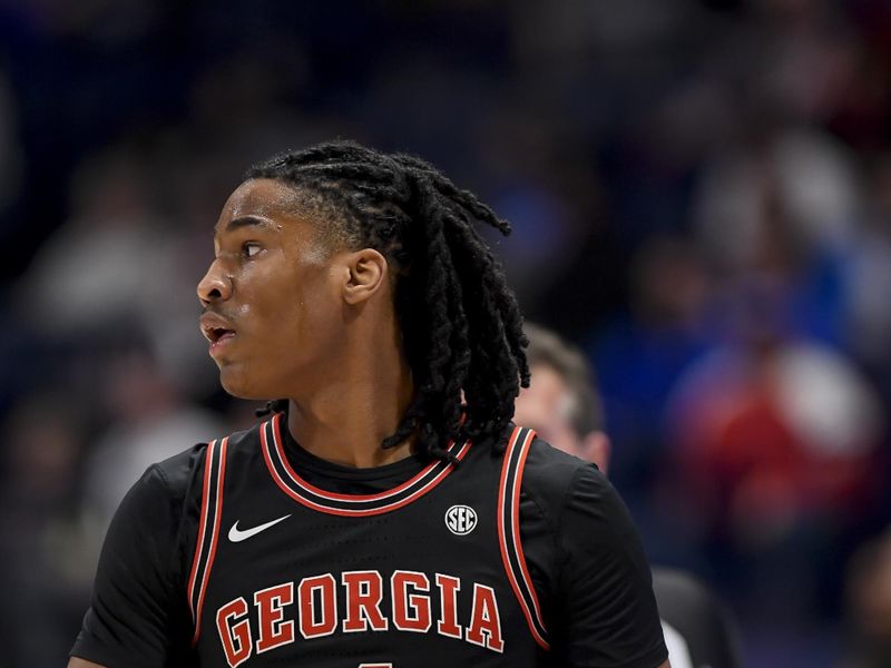 Mar 14, 2024; Nashville, TN, USA;  Georgia Bulldogs guard Silas Demary Jr. (4) holds the ball against the Florida Gators during the first half at Bridgestone Arena. Mandatory Credit: Steve Roberts-USA TODAY Sports