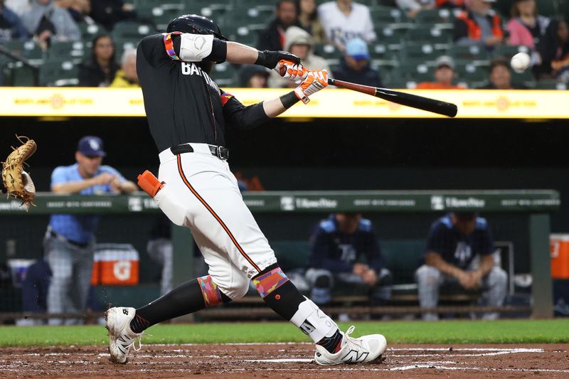 Jun 27, 2025; Baltimore, Maryland, USA; Baltimore Orioles outfielder Colton Cowser (17) hits a double during the second inning against the Tampa Bay Rays at Oriole Park at Camden Yards. Mandatory Credit: Daniel Kucin Jr.-Imagn Images