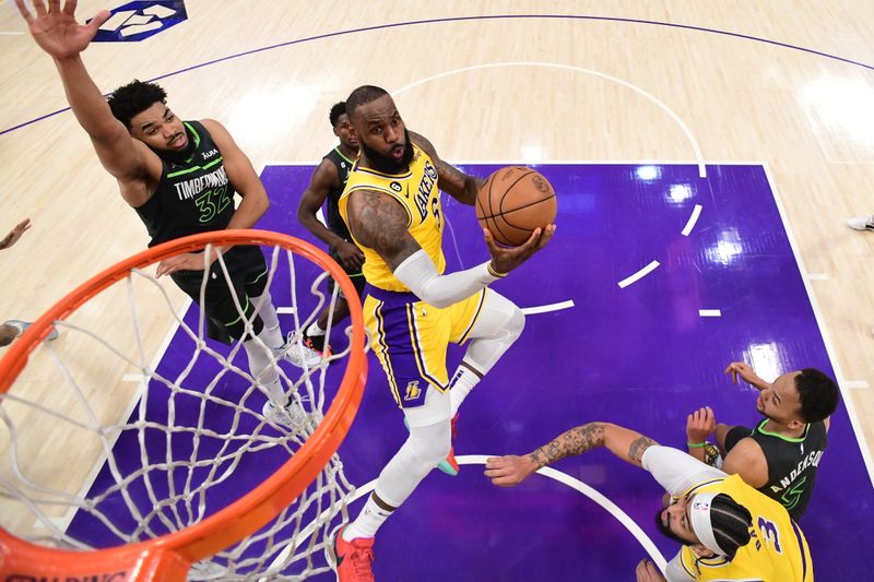 LOS ANGELES, CA - APRIL 11: LeBron James #6 of the Los Angeles Lakers drives to the basket during the game against the Minnesota Timberwolves during the 2023 Play-In Tournament on April 11, 2023 at Crypto.Com Arena in Los Angeles, California. NOTE TO USER: User expressly acknowledges and agrees that, by downloading and/or using this Photograph, user is consenting to the terms and conditions of the Getty Images License Agreement. Mandatory Copyright Notice: Copyright 2023 NBAE (Photo by Adam Pantozzi/NBAE via Getty Images)