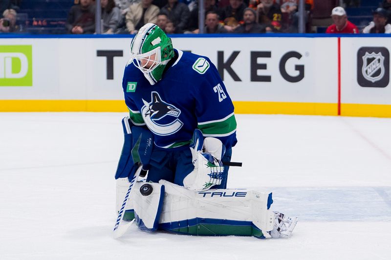 Dec 28, 2023; Vancouver, British Columbia, CAN; Vancouver Canucks goalie Casey DeSmith (29) makes a save against the Philadelphia Flyers in the first period at Rogers Arena. Mandatory Credit: Bob Frid-USA TODAY Sports