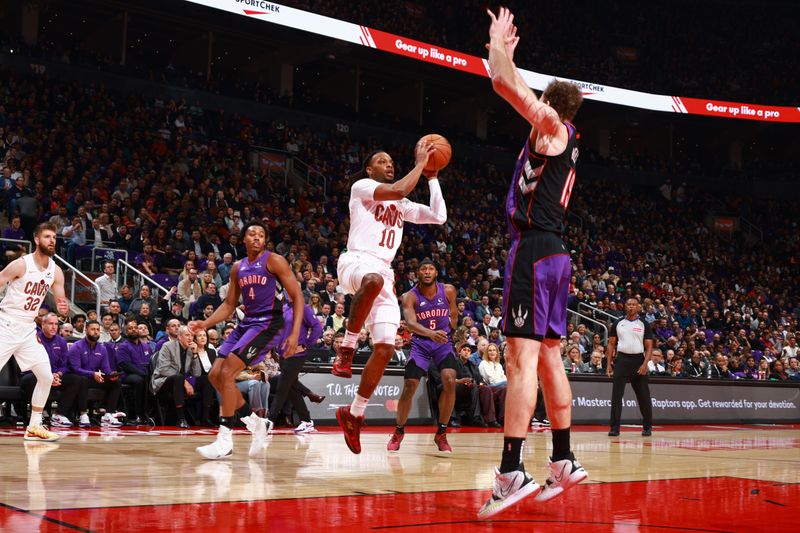 TORONTO, CANADA - OCTOBER 23: Darius Garland #10 of the Cleveland Cavaliers looks to pass the ball during the game against the Toronto Raptors on October 23, 2024 at the Scotiabank Arena in Toronto, Ontario, Canada.  NOTE TO USER: User expressly acknowledges and agrees that, by downloading and or using this Photograph, user is consenting to the terms and conditions of the Getty Images License Agreement.  Mandatory Copyright Notice: Copyright 2024 NBAE (Photo by Vaughn Ridley/NBAE via Getty Images)